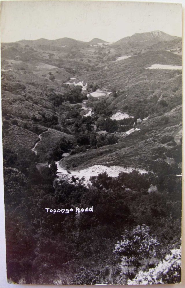 Black-and-white vintage photo of Topanga Road winding through the hills of Topanga Canyon