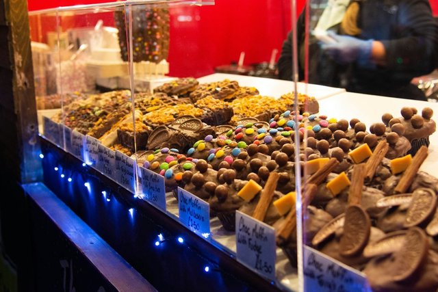 A display case filled with an assortment of handmade chocolates