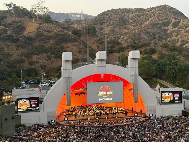 The Hollywood Bowl amphitheater shell lit up at night in Los Angeles