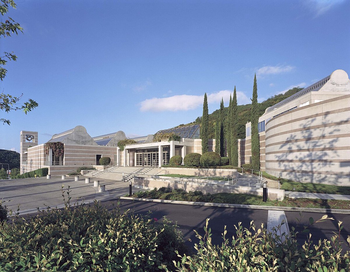 Skirball Cultural Center building exterior with warm stone architecture and clear Los Angeles sky