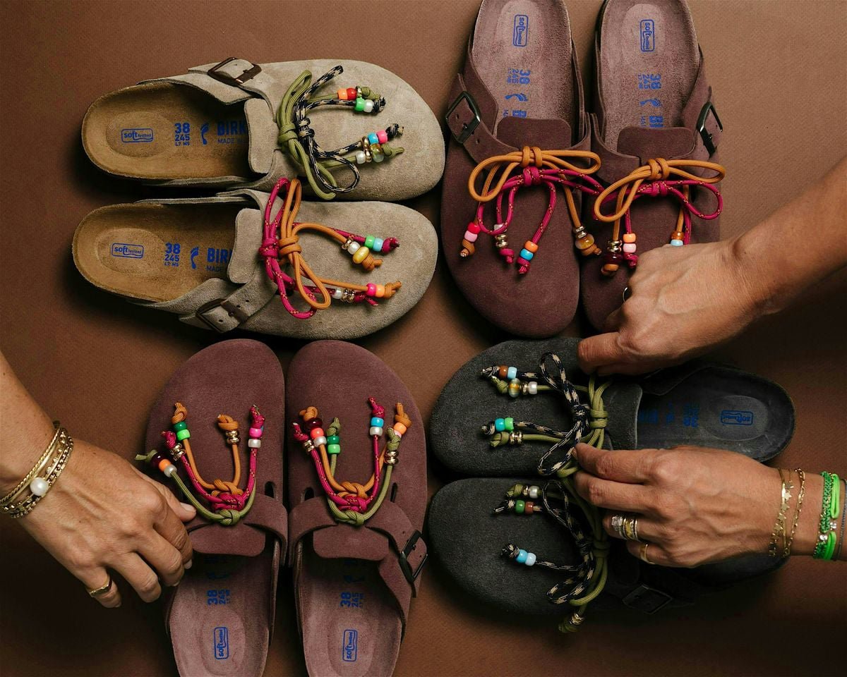 Close-up of colorful Birkenstock sandals displayed on a wooden surface