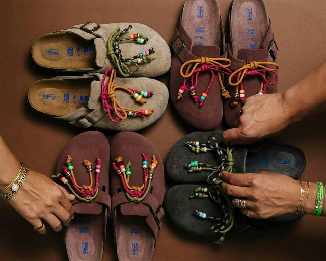 Close-up of colorful Birkenstock sandals displayed on a wooden surface