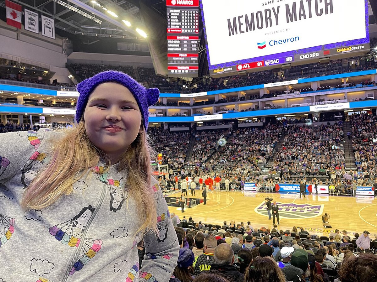 Sacramento Kings fans packed into the stands during an NBA game, team colors filling the arena