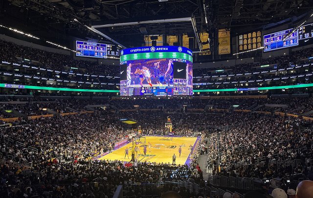 Crypto.com Arena interior showing the basketball court and seating bowl lit up for a game