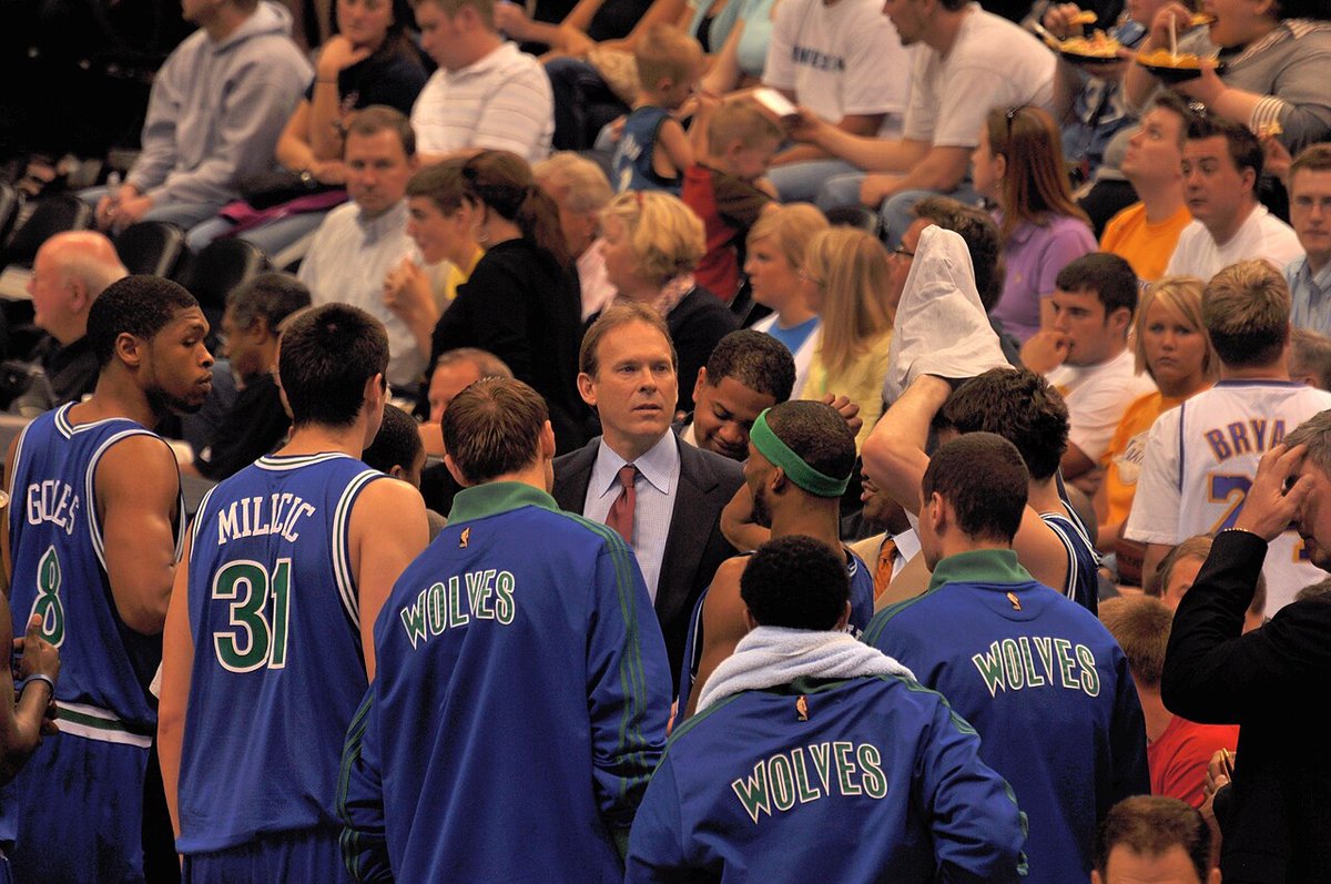 Kurt Rambis in a Lakers huddle during a basketball game