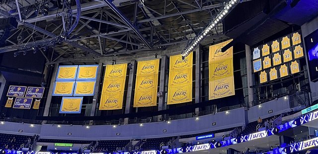 Lakers championship banners and retired jersey numbers hanging from the rafters inside Crypto.com Arena