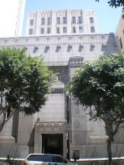 The granite Art Deco front of the building at 618 S Spring Street that houses Exchange LA in downtown Los Angeles