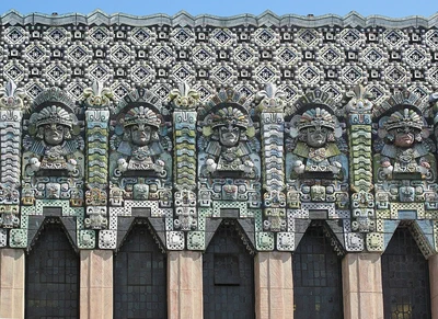 Carved Mayan Revival figures and patterned stonework across the facade of The Mayan on Hill Street in downtown Los Angeles