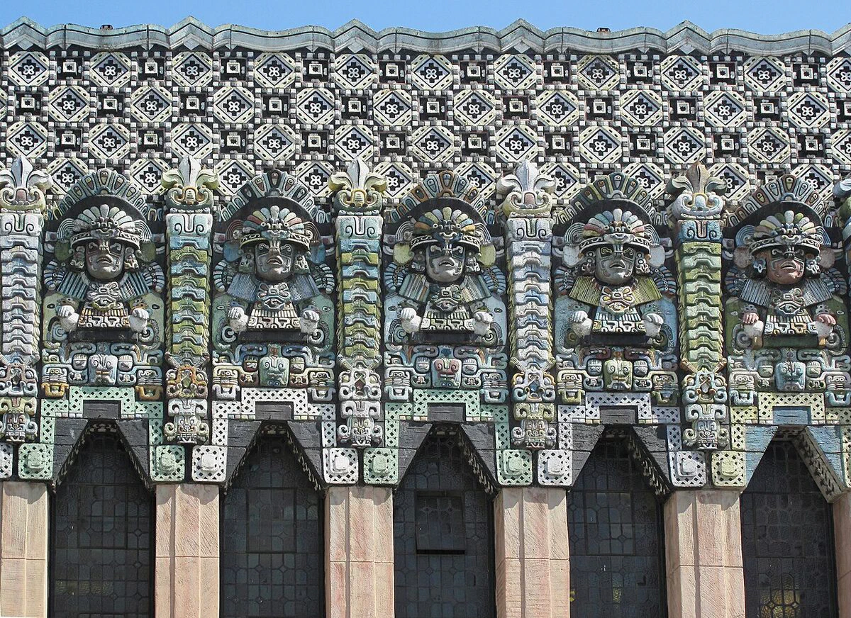 Carved Mayan Revival figures and patterned stonework across the facade of The Mayan on Hill Street in downtown Los Angeles