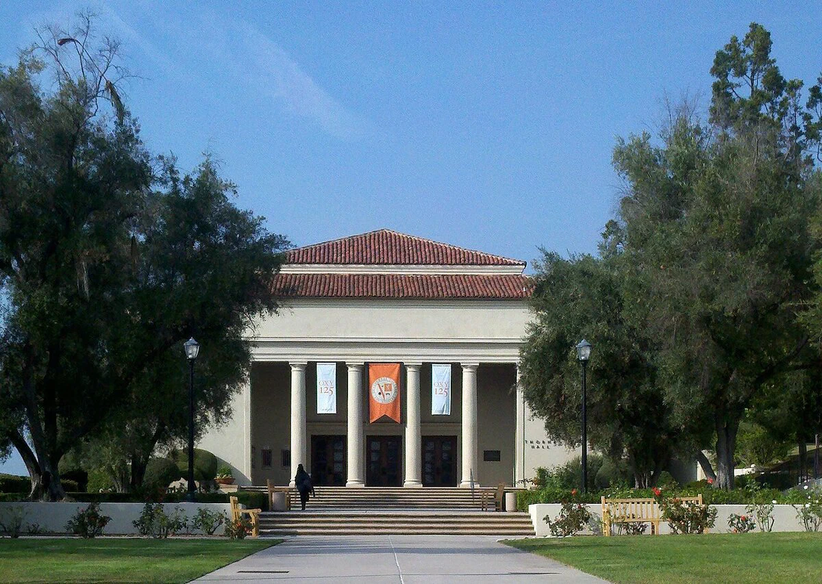Thorne Hall at Occidental College, a cream-colored classical hall with a red tile roof and four columns at the top of a wide set of steps